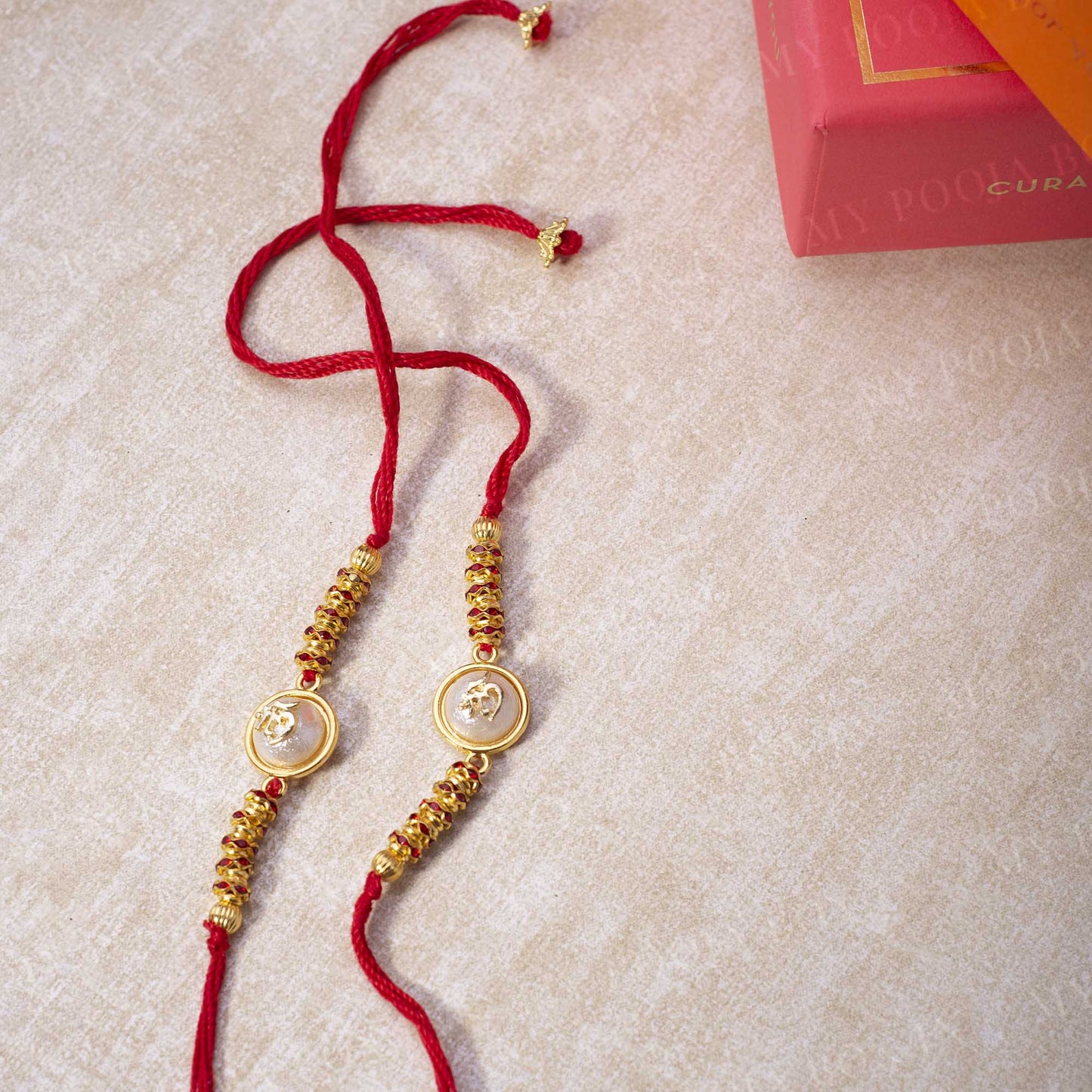 "Om" Opalescent Rakhi (Set of 2)