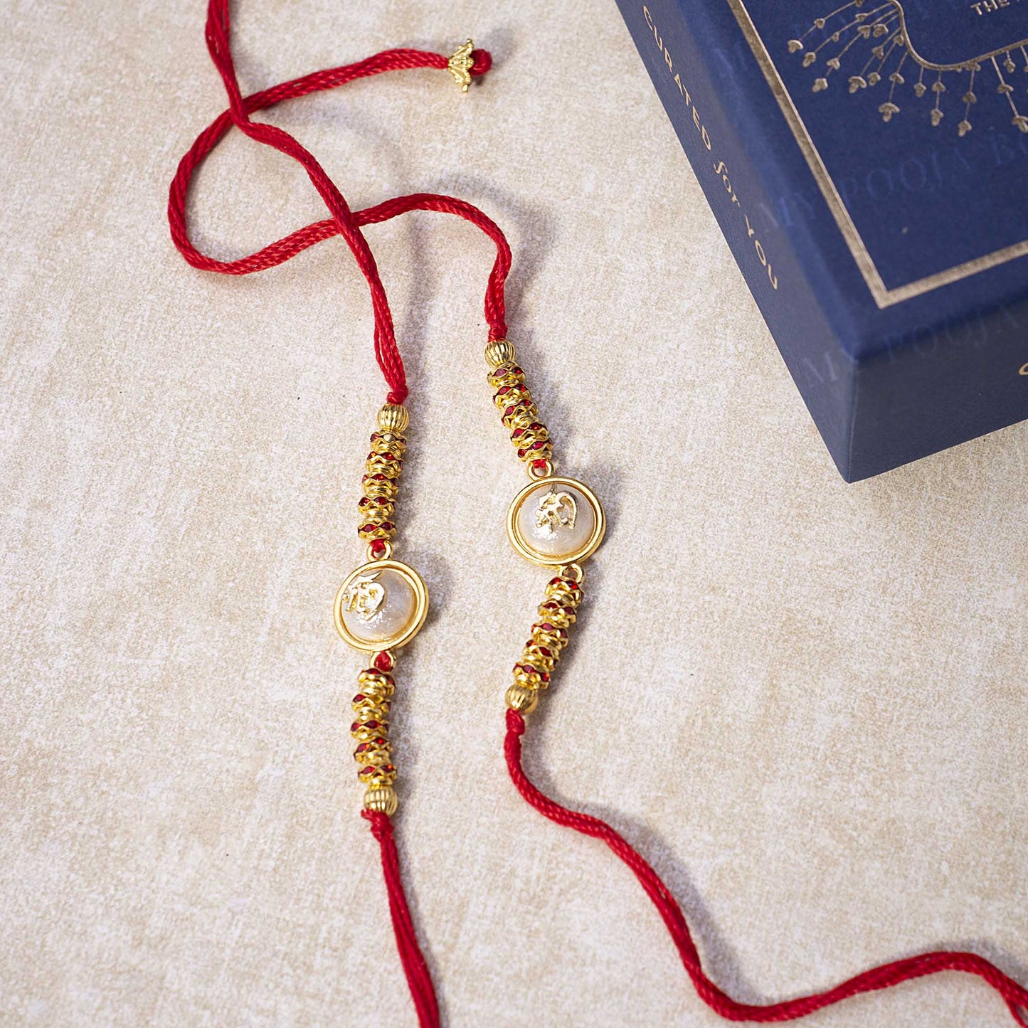 "Om" Opalescent Rakhi (Set of 2)
