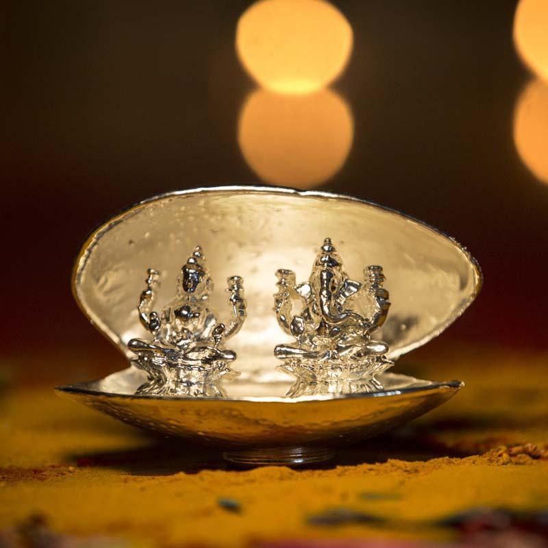 stunning silver metal laxmi ganesh statue for home decor in a shell